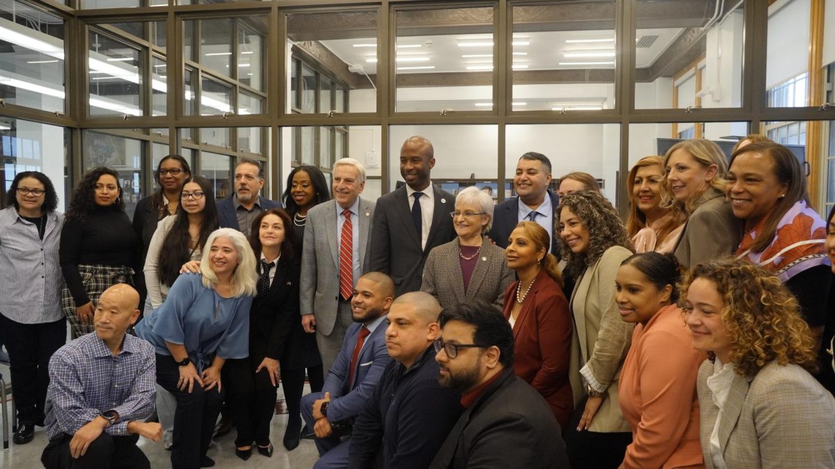 The DOE Chancellor Kamar Samuels with RHHS staff, elected officials, and journalists.