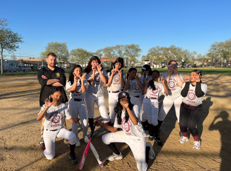 Junior Varsity softball team wins against New Town High School