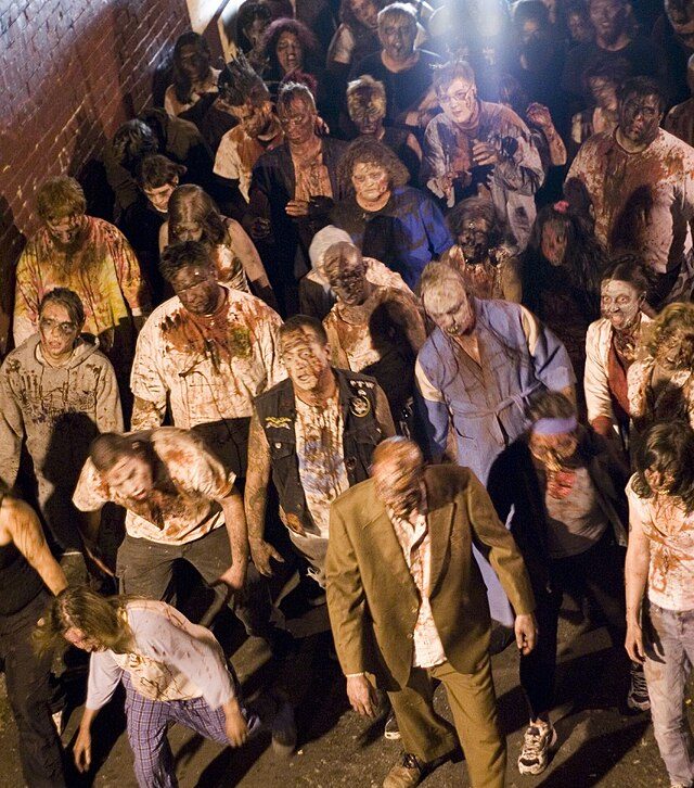 Friesen, Joel. “Group of zombies, shooting of the film Meat Market 3.” Flickr, 13 June 2006. Licensed under CC BY 2.0. Via Wikimedia Commons.
